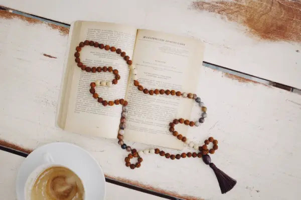 The Mala Beads on a Wooden Table Showcase a Sense of Serenity
